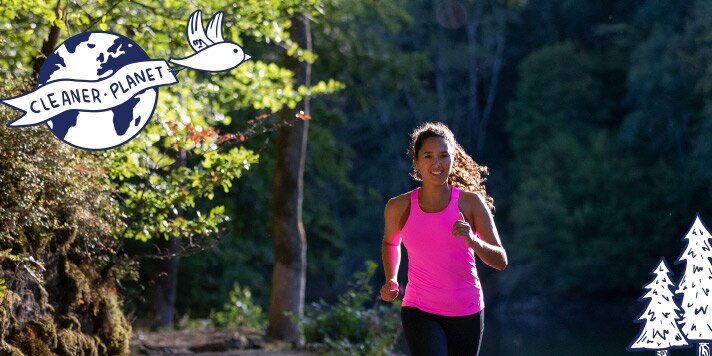 Women running through a forest