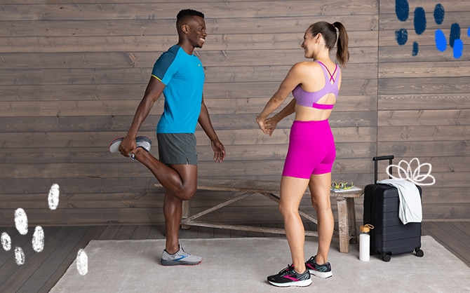 Two people stretching