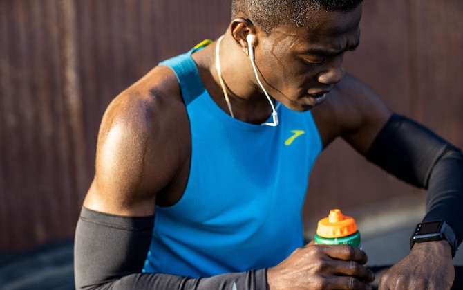 Man checking his watch after a run
