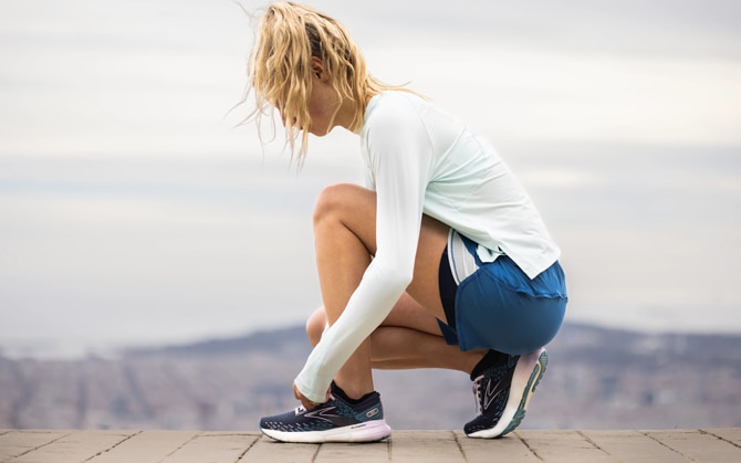 woman tying her shoe