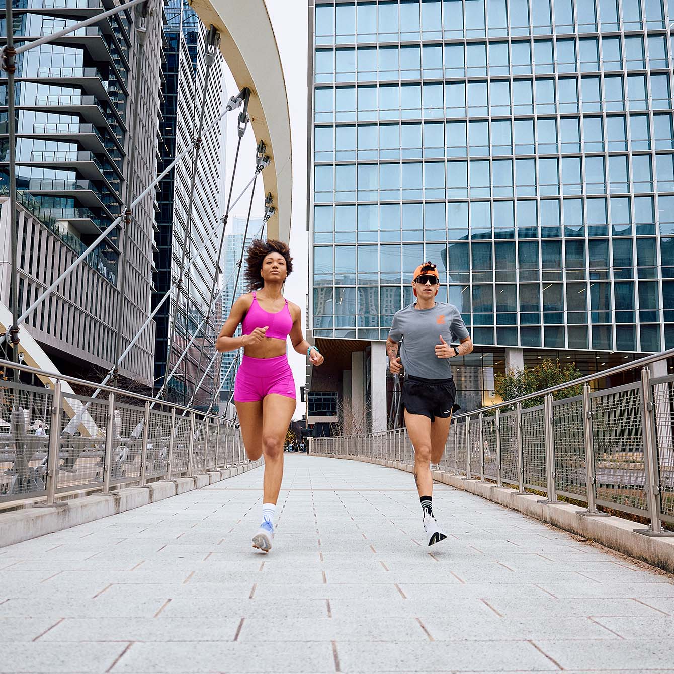 two runners on the street running in brooks shoes 