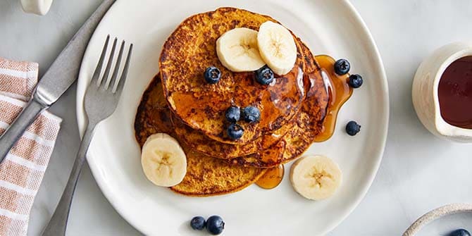 Pumpkin protein pancakes with blueberries and bananas