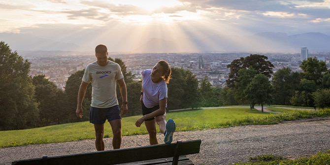Two runners stretching