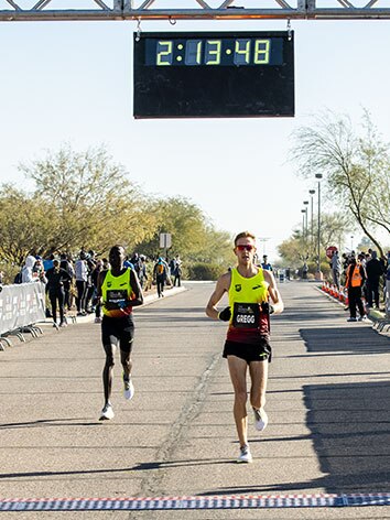Brendan Gregg crosses the finish line