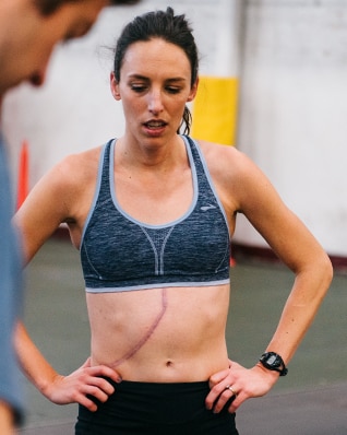 Gabe rocking a scar across her abdomen while at practice