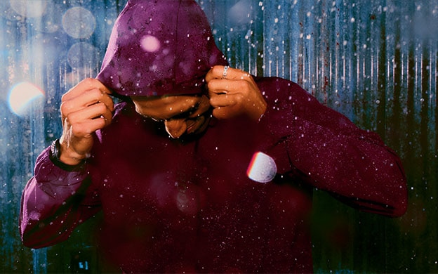 Man wearing Brooks gear in the rain