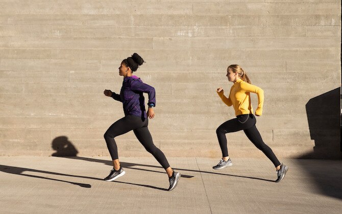 Two runners mid-stride