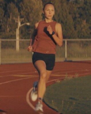Rosalie running on a track