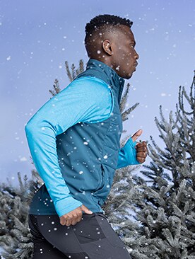 Man running in a blue vest