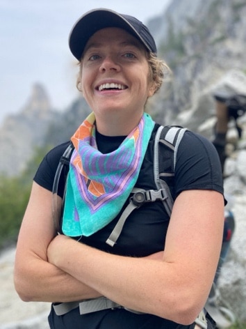 woman crossing her arms and smiling