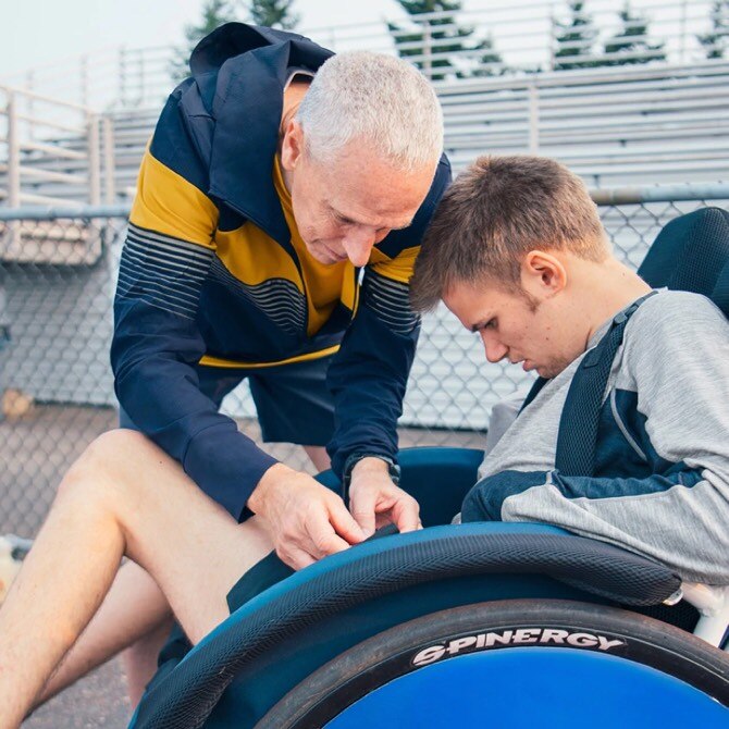 Peter Kline preparing with a rider-athlete for a run
