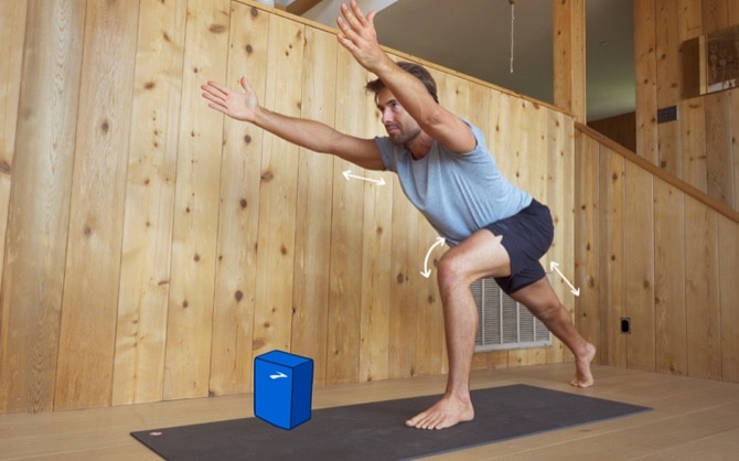 Side of Tim Senesi doing yoga