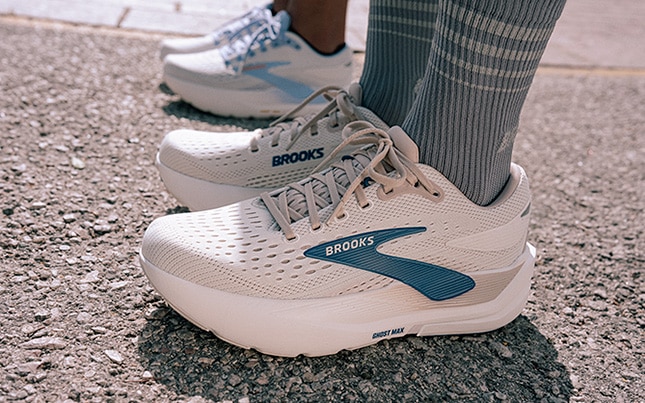 Close-up of someone’s feet wearing the Ghost Max 3 with a second person wearing the same shoes in the background