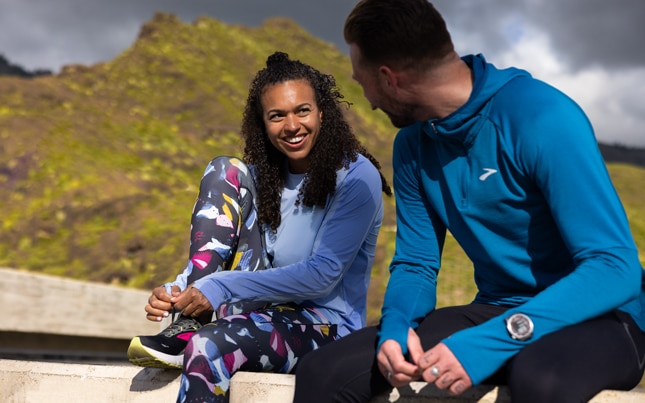 A runner stops to breathe while experiencing a cramp during a run.