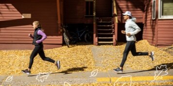 Two runners in fall outfits