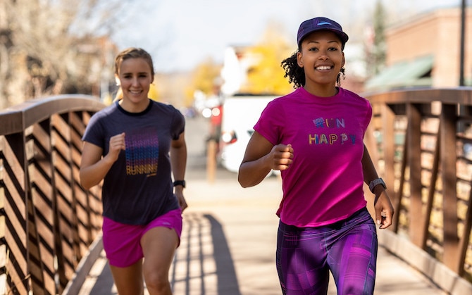 Two runners smiling