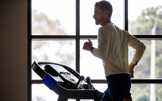 man running on treadmill