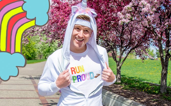 Mikah wearing a run proud t-shirt, and a unicorn onesie