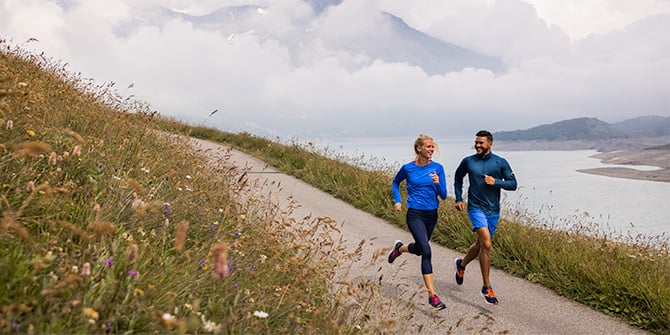 Two runners on a trail