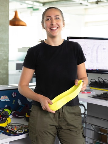 Women holding shoe sole