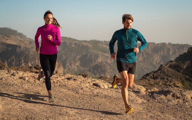 Two runners on a rocky trail