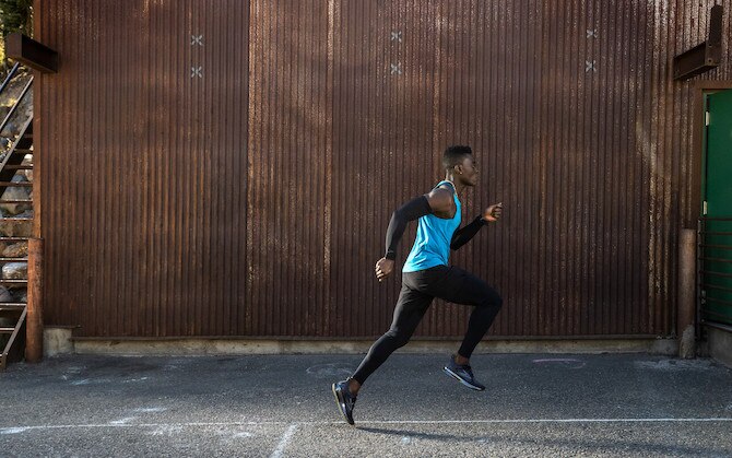 Runner running down the sidewalk