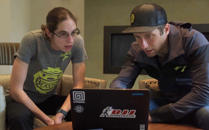 Colleen and Danny looking at a laptop together