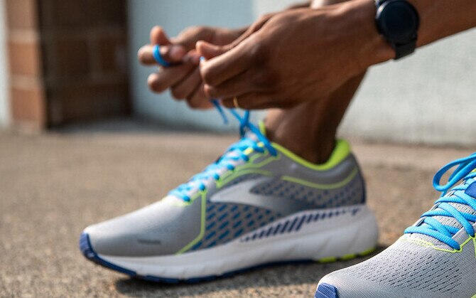 Runner tying their shoes