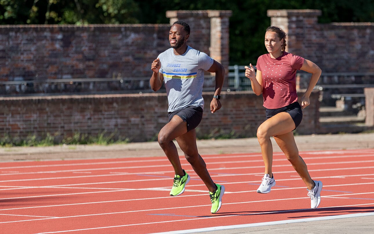 Two runners sprinting down a track.