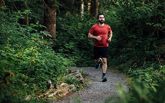 Male trail runner in the forest