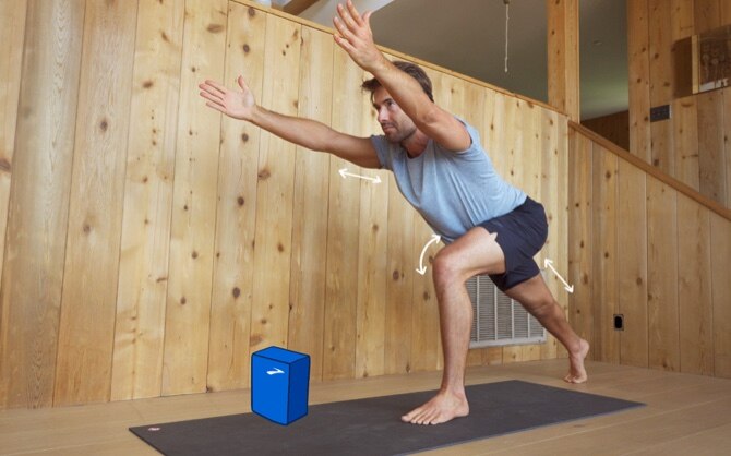 Side of Tim Senesi doing yoga