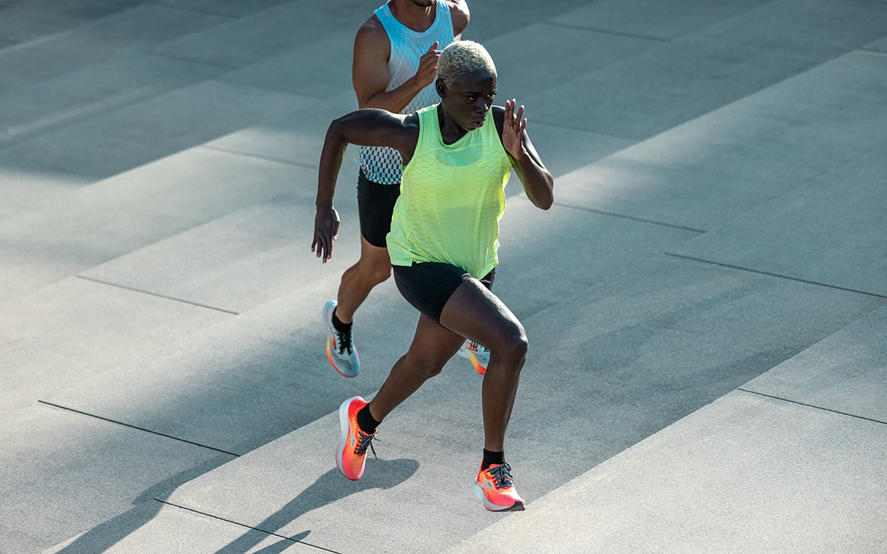 Two Runnears wearing the Hyperion Max and Hyperion Elite
