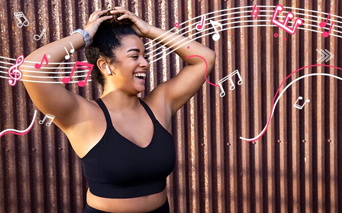 Woman with her arms up and illustrated music notes