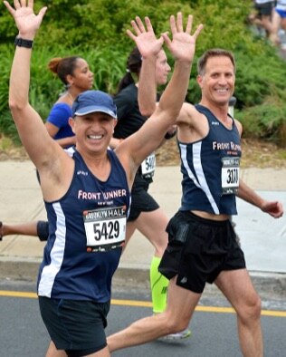 Zander Ross with his arms in the air 