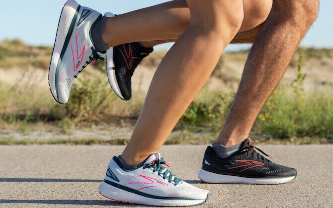 Two runners striking the ground at the same time