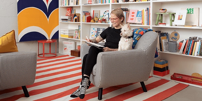 Lisa and her dog on a couch