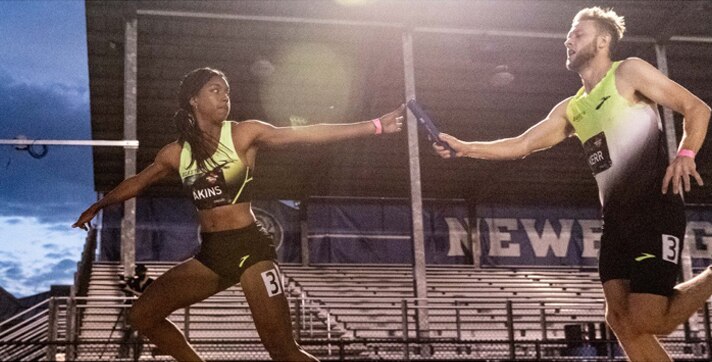 Nia Akins in a relay race
