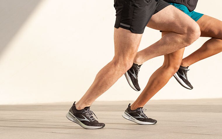 Close-up of two runners’ legs, both wearing the Bedlam 2.