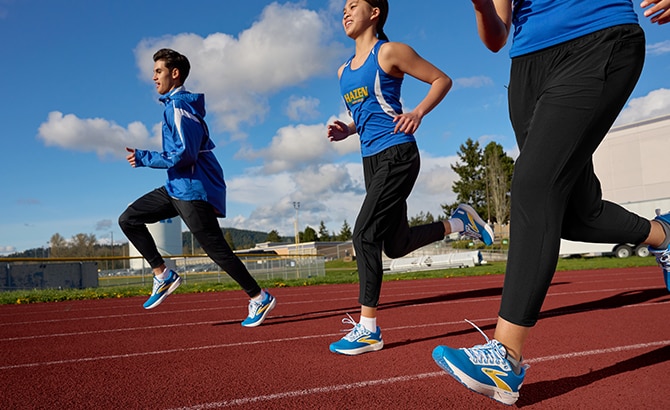 Three runners on a track