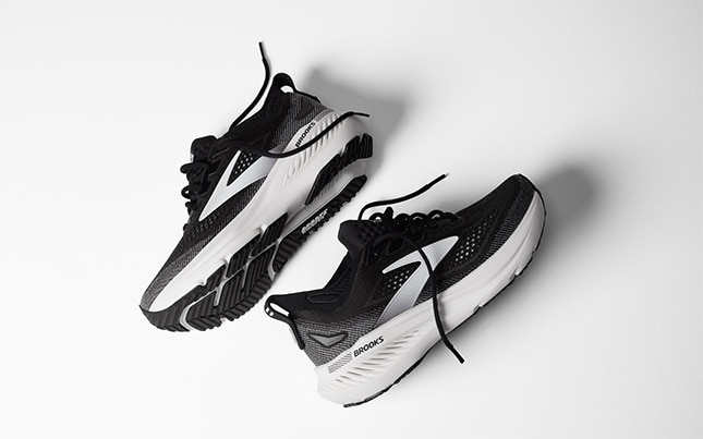 a pair of black Brooks Glycerin GTS 23 running shoes on a white background
