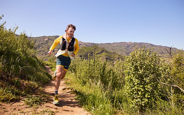 Two runners on dirt path