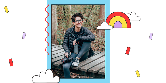 Photographer Steph Grant sitting on a boardwalk in the forest