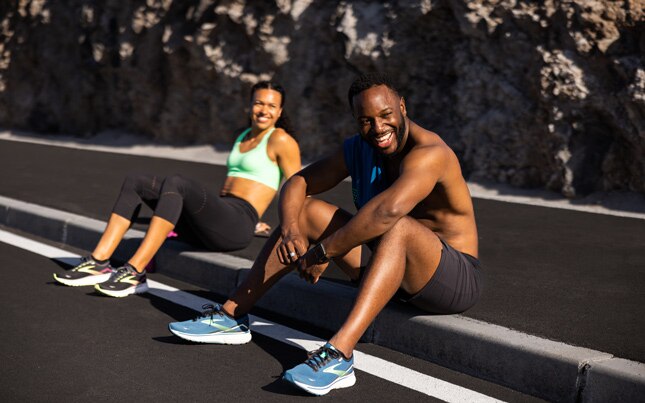Two people taking rest after running