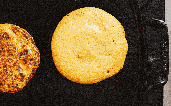 Pumpkin protein pancake on griddle