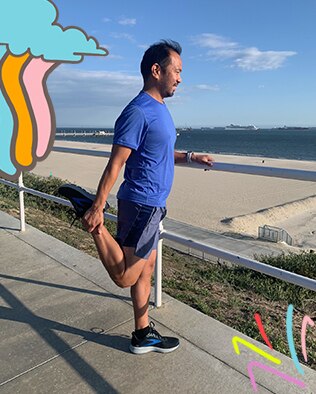 Runner stretching on the beach