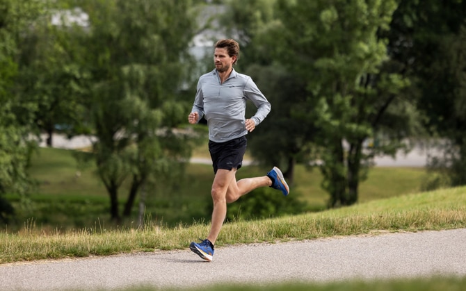 Runner running through a park