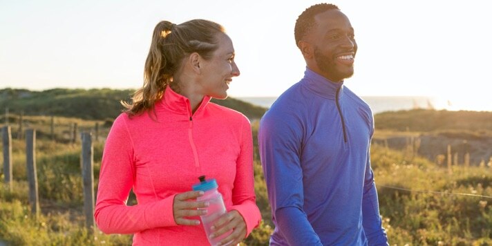 Two runners wearing dash 1/2 zips
