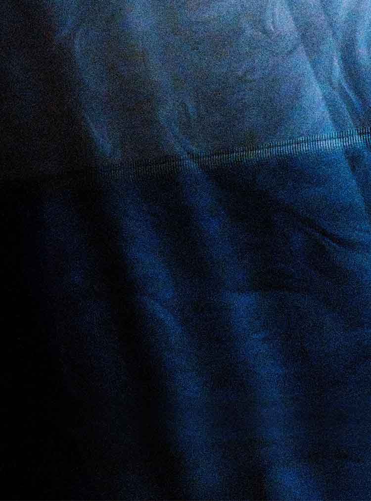 A dark blue backdrop