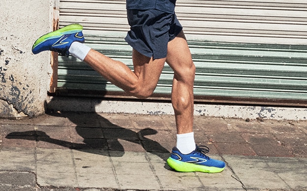 Medium shot of a man wearing the Glycerin 21 running shoes