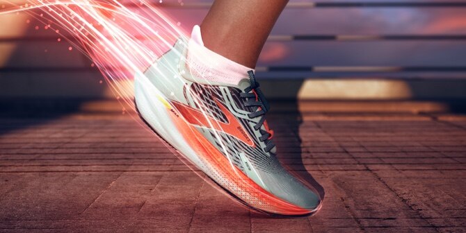 Side view of running shoe with illustrated red light strikes behind it
